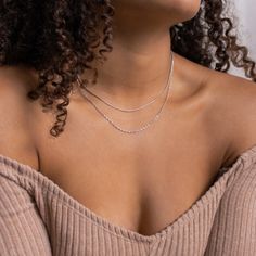 Layering just got easier with the Monet Duo Chain. A dainty snake chain sits atop a sparkling twist chain, otherwise known as a Singapore chain. An effortless and edgy layered look is just one clasp away. Material: High Quality Solid 925 Sterling Silver Finish: Sterling Silver ∙ 18K Gold Featuring a Minimalist Layered Necklace Set with a 14 inch Snake Chain layered with a 15 inch Singapore Chain, length is adjustable up to 2 inches SKU: RR-NR066 Double Snake Chain Necklace, Dainty Snake Chain Necklace For Layering, Dainty Silver Snake Chain Necklace With Delicate Chain, Dainty Silver Snake Chain Necklace With Delicate Details, Minimalist Snake Chain Layered Necklace, Trendy Layered Snake Chain Necklace With Delicate Details, Silver Snake Chain Layered Necklace, Snake Chain Necklace With Double Chain For Layering, Double Chain Snake Necklace For Layering