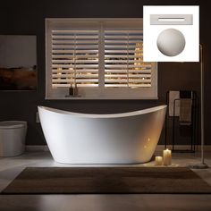 a white bath tub sitting next to a window with shutters on the windowsill