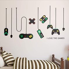 a bedroom with video game controllers and i love the games wall decals