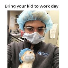 a person wearing a face mask and holding a small cat in their arms with the caption saying, bring your kid to work day