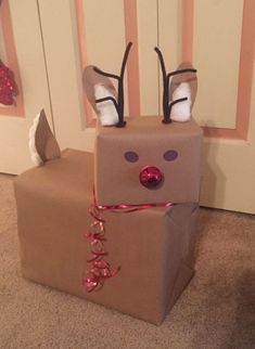 a cardboard box with reindeer head and antlers on it