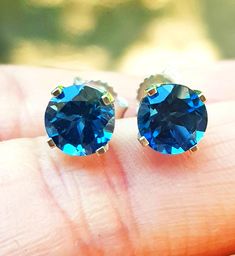 Make a statement with these sparkling and shimmery London Blue Topaz stud earrings. 💎 . Perfect for the bride  👰 . A wonderful gift for a loved one for any occasion.💝 . London Blue Topaz 💎 is the birthstone for December  GEMSTONE DETAILS: BRAND NEW Natural London Blue Topaz Round Cut Total of 1.30CT London Blue Topaz Stones - 6.0 mm Diameter each Total of 2.00CT London Blue Topaz Stones - 6.8 mm Diameter each CLARITY: VS COLOUR: Medium Blue TREATMENTS: Heated WEIGHT: 1.0-1.5 grams  JEWELLERY Blue Birthstone Earrings For Formal Occasions, Formal Blue Birthstone Earrings, Blue Round Earrings For Anniversary, Sapphire Round Cut Anniversary Earrings, Blue Brilliant Cut Earrings For Anniversary, Sapphire Round Cut Earrings For Anniversary, Blue Cubic Zirconia Earrings With Brilliant Cut, Classic Blue Diamond-cut Earrings, Blue Prong Set Fine Jewelry Earrings