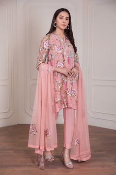 Fancy Pakistani dresses embellished with floral colorful panels all over. Large variety available with net fabric embroidery in fancy Pakistani dresses Designer Pink Kurta For Spring, Designer Peach Dress With Intricate Embroidery, Designer Spring Pink Kurta, Spring Designer Pink Kurta, Peach Dress With Intricate Embroidery For High Fashion, Designer Peach Dress With Resham Embroidery, Peach Semi-stitched Dress For Designer Wear, Peach Tailored Dress For Designer Wear, Semi-stitched Pink Floral Embroidered Dress