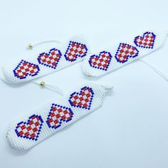 "This beautiful tribute to Croatian heritage is the perfect addition to your jewelry collection! This beaded bracelet features three checkered hearts and can fit all wrist sizes. \"Hrvatsko srce je u meni, srce sto nikad nema mira\"" Niece And Nephew, Heart Beads, Organza Bags, Beaded Bracelet, Embroidered Friendship Bracelet, Jewelry Collection, Beaded Bracelets, Stud Earrings, Bracelet