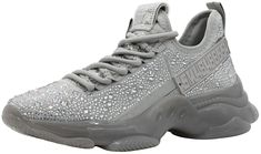 PRICES MAY VARY. Fits narrow, Half to full size up recommended Easy slide on lace-up fashion sneaker Rhinestone embellishments with rubber logo detail at side Comfortable lycra and knit design, synthetic sole Fit Tip: Runs small, size up 1/2 size for optimal fit Steve Madden Sneakers, Winter Work, Trainers Fashion, Rhinestone Embellishments, Christmas Gift Guide, Slide On, Athletic Fashion, Wedge Sneaker, Holiday Christmas