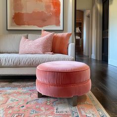 Explore playful sitting room furniture ideas in coral pink. Discover how a loveseat, accent chairs, an ottoman, or a bookshelf can transform your space with vibrant style and charm.