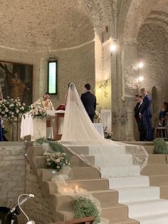 the bride and groom are getting married at the alter with their bikes parked in front of them