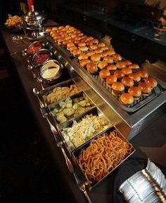 an assortment of food is displayed on a buffet