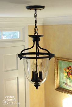 a chandelier hanging from the ceiling in a home