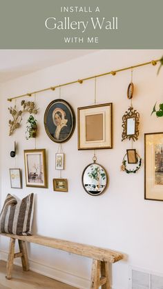 a wooden bench sitting next to a wall covered in pictures and framed art on it