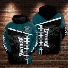 the philadelphia eagles hoodie is shown against a brick wall