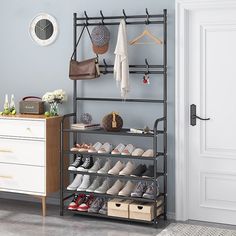 a shoe rack with shoes on it next to a dresser