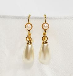 "Bridal Pearl Earrings, Pearl Stud Earrings, Bridal Earrings, Bridal tear drop pearl earrings, Wedding accessories, Gold and pearl jewelry for the bride. The bridal pearl earrings, features Swarovski teardrop pearl with a stud gold coated earring, and tiny Swarovski pearl inlay. The studs can be replaced with a hook hanging earring also with Swarovski pearl inlay. (Appear in the fourth photo). The design is very delicate, made with fine 24K gold plated earrings, NICKEL FREE. You can choose your Elegant Cream Jewelry For Wedding, Classic Pearl Drop Bridal Earrings, White Teardrop Earrings For Evening, Classic White Bridal Earrings With Elegant Design, Formal Pearl White Bridal Earrings, Formal Cream Pearl Earrings, Classic Gold Pearl Teardrop Earrings, Gold Pearl Teardrop Earrings For Formal Occasions, Classic Pearl White Drop Bridal Earrings