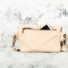 This Beige Leather Fanny Pack is the ideal bag if you like carrying all your necessities, keep your hands free and look effortlessly fashionable at the same time! Perfect for festivals, markets and travelling. Simple and beautiful bag made of a high quality Italian leather, which is soft to touch, strong, durable and a very fine material. Top grade thicker leather is used for the adjustable belt. This hip bag features one separate compartment closed by a zipper in the back and another zippered p Trendy Travel Belt Bag Shaped Like A Tote, Chic Chest Bag With Removable Pouch For On-the-go, Multifunctional Crossbody Bags For On-the-go, Beige Crossbody Belt Bag For On-the-go, Trendy Satchel Pouch For Daily Use, Versatile Belt Bag With Detachable Strap, Trendy Camera Shoulder Bag For Everyday Use, Trendy Everyday Use Shoulder Camera Bag, On-the-go Bag With Zipper Pocket And Pouch Shape