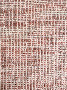 an orange and white checkered fabric textured upholstered with some red dots