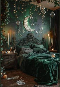 a bedroom with green walls and decorations on the wall, candles in front of the bed