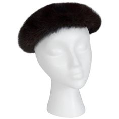 Looking glamorous and staying warm don't have to be mutually exclusive. Take a page from "Dr. Zhivago" and try a fur hat: you'll feel instantly chic and soften your features at the same time. This one is even lined in metallic brocade and features hair combs to help avoid "hat head." Black beret/soft saucer hat with interior hair combs. Grosgrain interior sweatband; fully lined in metallic silk brocade. material: mink, silk brocade noteworthy: professionally fur clean only repairs: none conditio Black Beret, Dr Zhivago, Birger Christensen, Rhinestone Trim, Fur Hat, Beret Hat, Silk Brocade, Mink Fur, Hair Comb