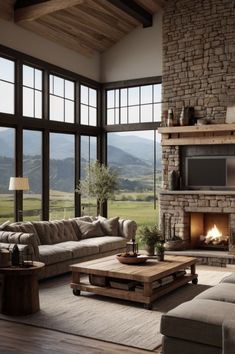 a living room filled with furniture and a fire place in the middle of a room