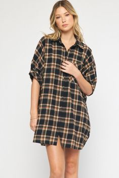 Oversized short sleeve button down flannel dress featuring pocket at bust. Unlined. Woven. Non-sheer. Lightweight.