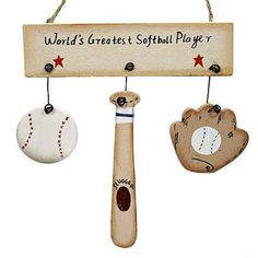 a wooden sign with three baseballs and a bat hanging from it's hooks