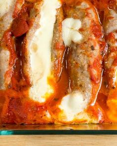 meatballs covered in marinara sauce and melted cheese