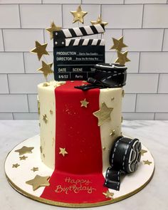 a red, white and blue birthday cake with gold stars