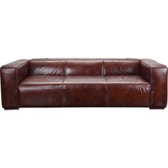 a brown leather couch sitting on top of a white floor