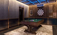 a room with a pool table and darts on the wall