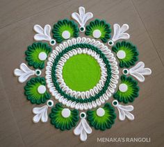 a green and white circular design on the floor