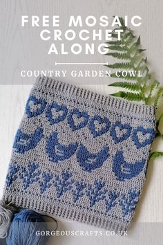 a blue and white crochet afghan next to a green plant