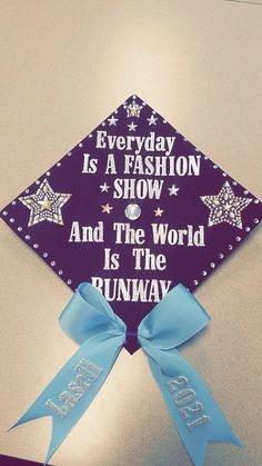 a purple and blue graduation cap that says, everyday is a fashion show and the world is the runway