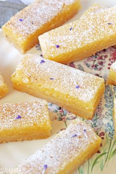 several pieces of cake sitting on top of a plate with sprinkles around it