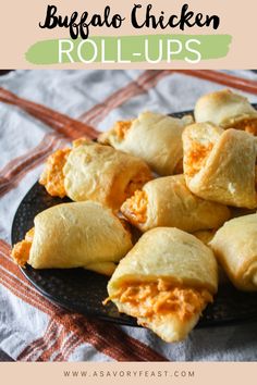 buffalo chicken roll - ups on a black plate