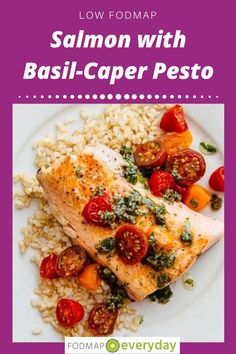 salmon with basil - caper pesto on top of rice and tomatoes in a white plate