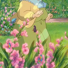 an animated image of a woman holding a baby in the grass with pink flowers around her