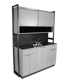 a black and white photo of a kitchen with sink, cabinets and cupboards on the wall