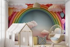 a child's room decorated in pastel colors with rainbows and clouds painted on the wall