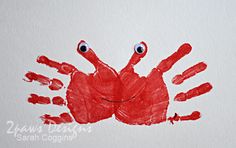 a red hand print with two hands and one eye