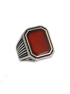 Man silver ring with a carnelian octagon stone. I have made this ring from sterling silver. It weights 10.50gr. Dimensions at the upper part are 1.90 to 1.0 cm. ( 0.75 to 0.39 inches ). I can make it to the size you will choose. Hallmarked Silver Octagonal Ring, Classic Octagon Ruby Ring For Gift, Elegant Silver Signet Ring With Carnelian, Silver Octagon Signet Ring As Gift, Octagon Sterling Silver Ring With Polished Finish, Elegant Silver Carnelian Signet Ring, Classic Silver Carnelian Jewelry, Red Carnelian Hallmarked Rings, Silver Rings With Polished Carnelian