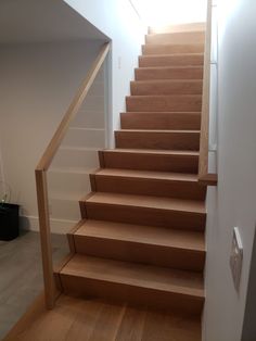 a set of wooden stairs leading up to a second floor