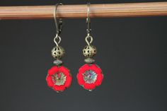 Red Earrings Czech Glass Earrings Flower Earrings Dangle Earrings Drop Earrings Gift For Her Gift for women Color : 12mm red Picasso Hawaii Flower Beads, Opaque, Czech Glass Beads, Hibiscus, Pansey Finish : Antiqued brass findings Size : 1,5 inches including the antiqued brass lever back Ear wires : Antiqued brass lever back Available in green, turquoise, navy blue, yellow, orange, purple and red: https://www.etsy.com/listing/744363663/blue-earrings-flower-earrings-dangle?ref=shop_home_active_27 Red Flower Drop Earrings, Red Bohemian Drop Flower Earrings, Red Dangle Flower Earrings, Red Flower Earrings With Ear Wire, Red Flower Earrings As Gift, Red Flower Earrings For Gift, Red Round Flower Earrings With Ear Wire, Red Flower Earrings For Pierced Ears, Red Flower Earrings With Ear Wire For Gift