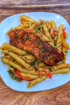 Easy Salmon Rasta Pasta Recipe Honey Jerk Salmon, Jamaican Rasta Pasta Recipe, Curried Goat Recipe, Rasta Pasta Recipe, Oxtail Recipe, Jamaican Oxtail, Jerk Salmon, Fish Dinners, Rasta Pasta