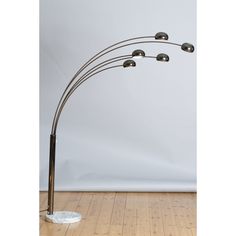 a floor lamp with five lamps on it