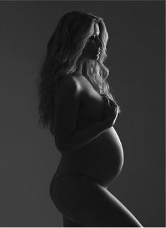 a pregnant woman posing for the camera