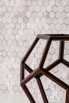 a metal object with hexagonal shapes on it's sides against a white background