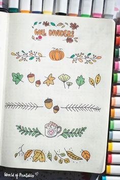 an open notebook with autumn doodles on it