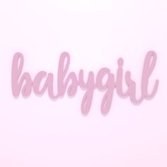 the word baby girl written in cursive pink paper on a pale pink background