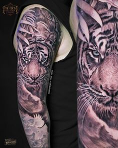 a man's arm with tattoos on it and an image of a tiger in the background