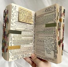 an open book with many different types of writing on it