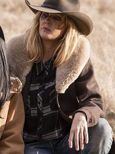 two women sitting next to each other wearing hats